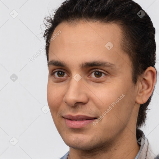 Joyful white young-adult male with short  brown hair and brown eyes