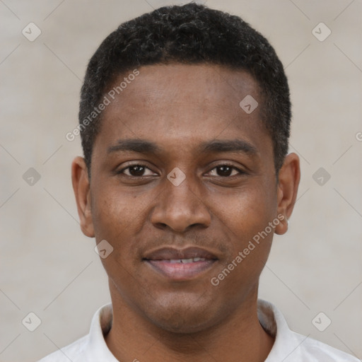 Joyful black young-adult male with short  black hair and brown eyes