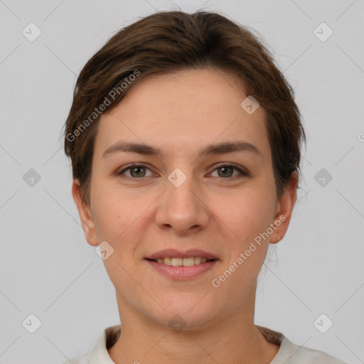 Joyful white young-adult female with short  brown hair and grey eyes