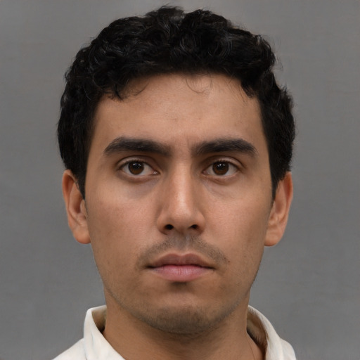 Neutral white young-adult male with short  black hair and brown eyes