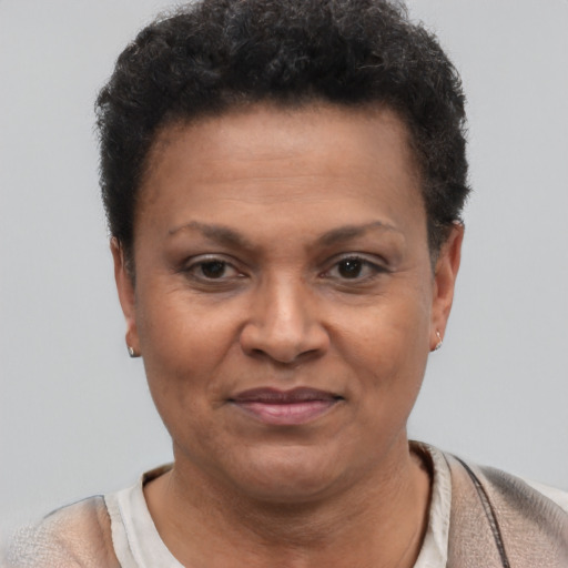Joyful latino adult female with short  brown hair and brown eyes