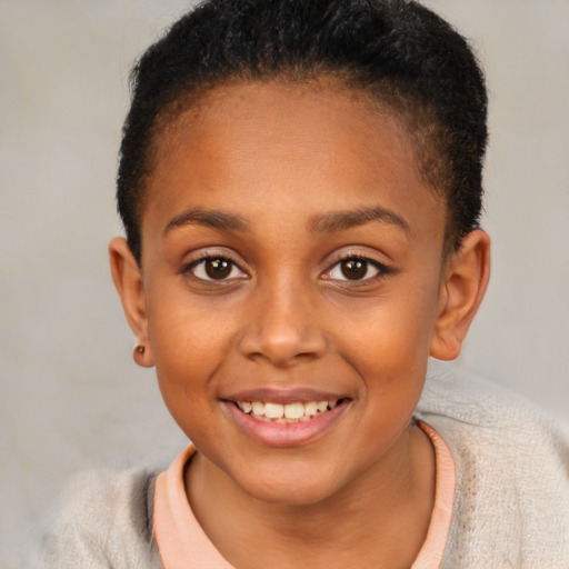 Joyful black child female with short  brown hair and brown eyes