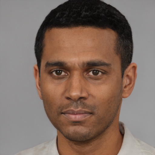 Neutral black young-adult male with short  black hair and brown eyes