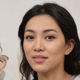 Joyful latino young-adult female with medium  black hair and brown eyes