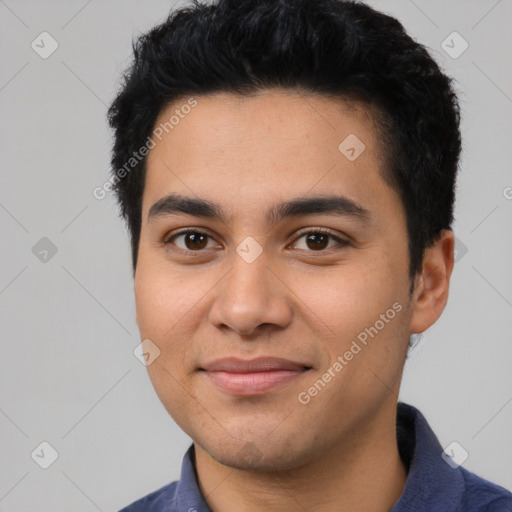 Joyful latino young-adult male with short  black hair and brown eyes