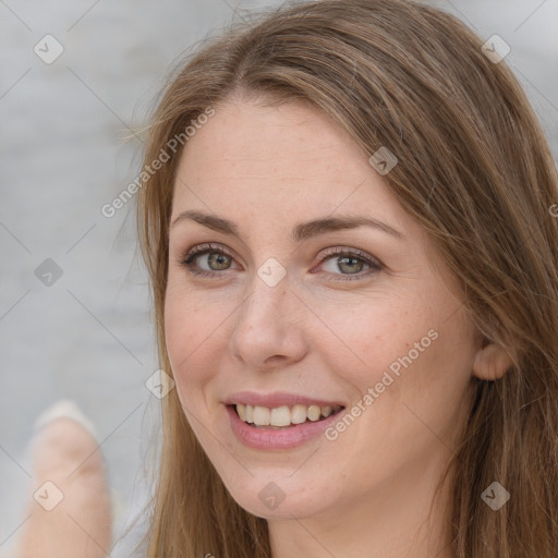 Joyful white adult female with long  brown hair and grey eyes