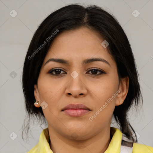 Joyful latino young-adult female with medium  brown hair and brown eyes