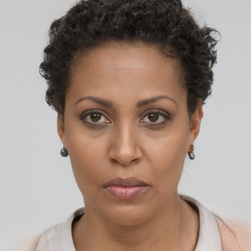 Neutral black young-adult female with short  brown hair and brown eyes