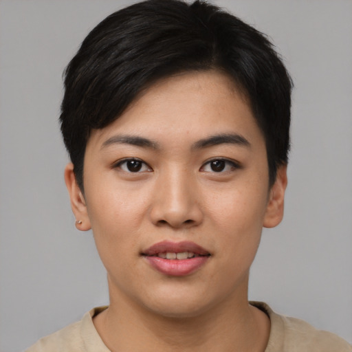 Joyful asian young-adult female with short  black hair and brown eyes