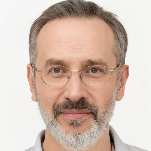 Joyful white middle-aged male with short  gray hair and brown eyes