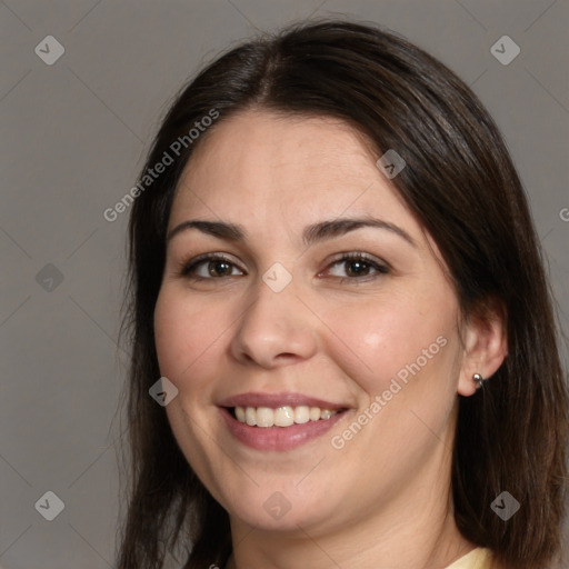 Joyful white young-adult female with long  brown hair and brown eyes