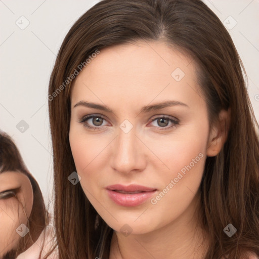 Neutral white young-adult female with long  brown hair and brown eyes