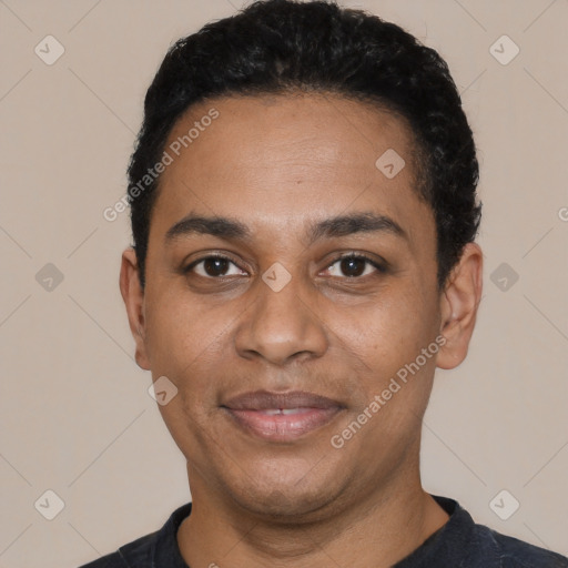 Joyful latino adult male with short  black hair and brown eyes