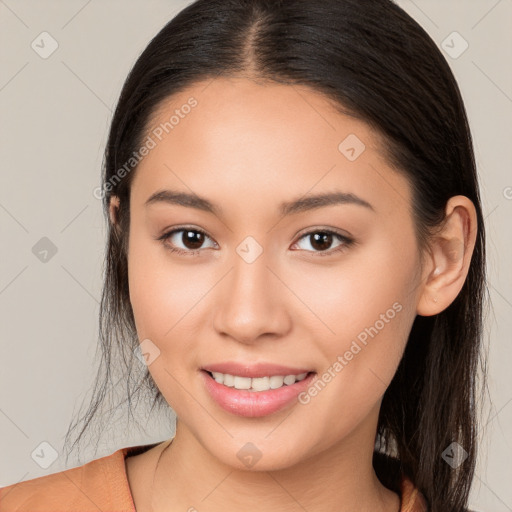 Joyful white young-adult female with long  brown hair and brown eyes