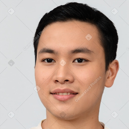 Joyful asian young-adult male with short  black hair and brown eyes