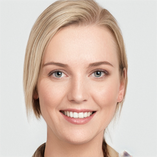 Joyful white young-adult female with medium  brown hair and blue eyes