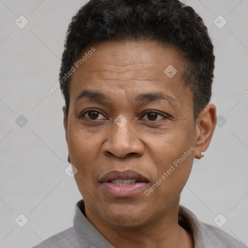 Joyful black adult male with short  black hair and brown eyes