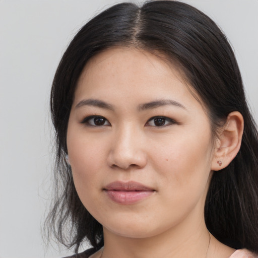 Joyful asian young-adult female with medium  brown hair and brown eyes