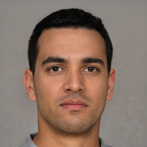 Neutral white young-adult male with short  black hair and brown eyes