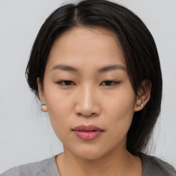 Neutral asian young-adult female with medium  black hair and brown eyes