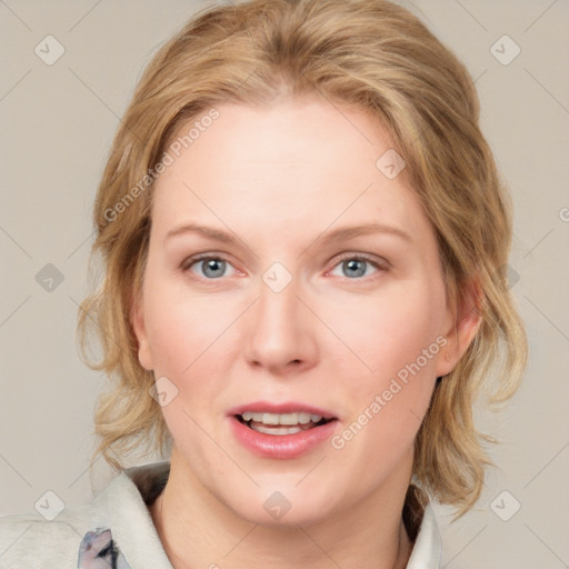 Joyful white adult female with medium  brown hair and blue eyes