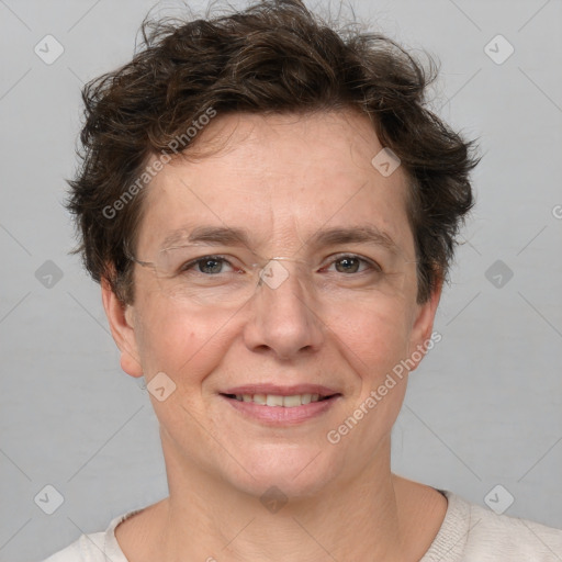 Joyful white adult female with short  brown hair and brown eyes