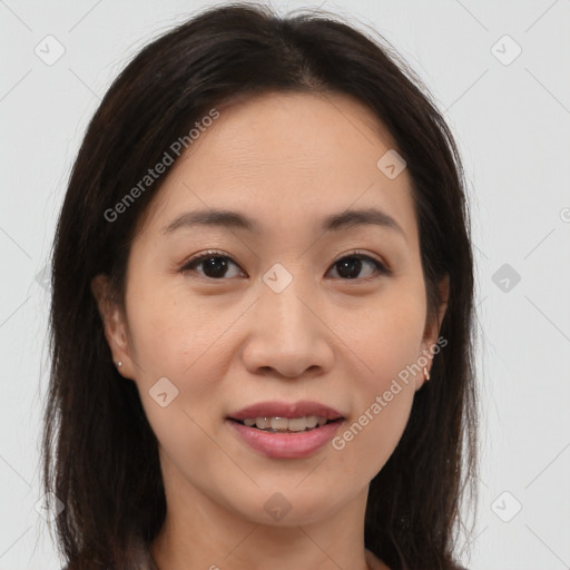 Joyful asian young-adult female with long  brown hair and brown eyes