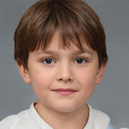 Joyful white child male with short  brown hair and brown eyes