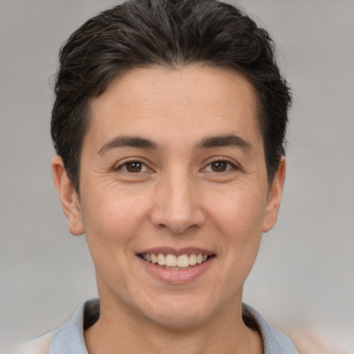 Joyful white adult male with short  brown hair and brown eyes