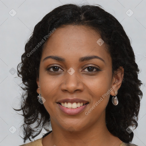 Joyful black young-adult female with long  brown hair and brown eyes