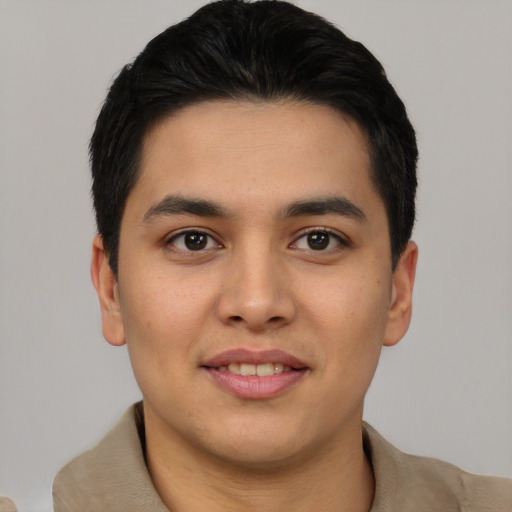 Joyful asian young-adult male with short  black hair and brown eyes