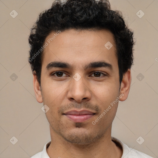 Joyful latino young-adult male with short  brown hair and brown eyes