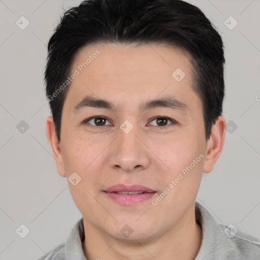 Joyful asian young-adult male with short  black hair and brown eyes