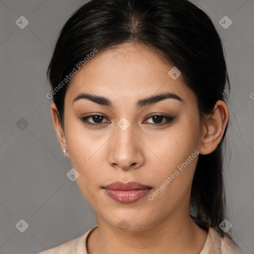 Joyful latino young-adult female with medium  brown hair and brown eyes