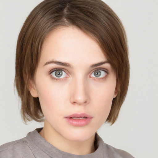 Neutral white young-adult female with medium  brown hair and grey eyes