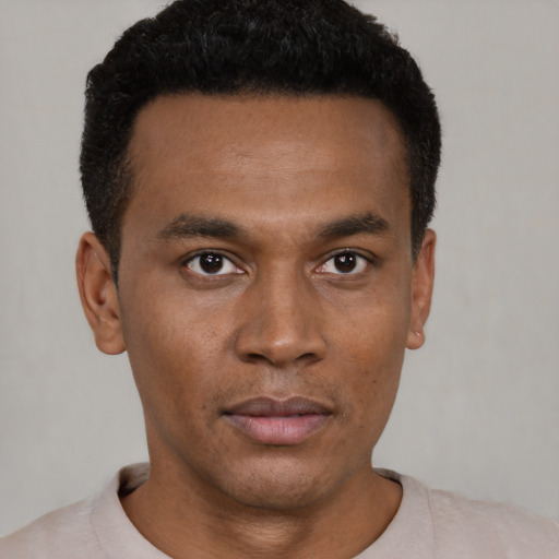 Neutral black young-adult male with short  black hair and brown eyes