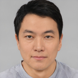 Neutral asian young-adult male with short  black hair and brown eyes