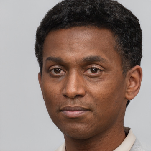 Neutral black young-adult male with short  black hair and brown eyes