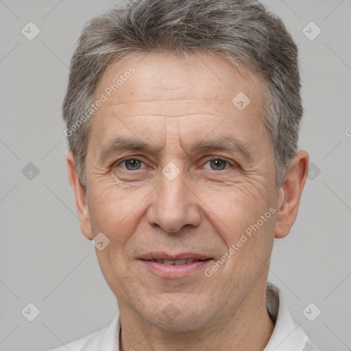 Joyful white middle-aged male with short  brown hair and brown eyes