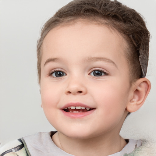 Joyful white child female with short  brown hair and brown eyes