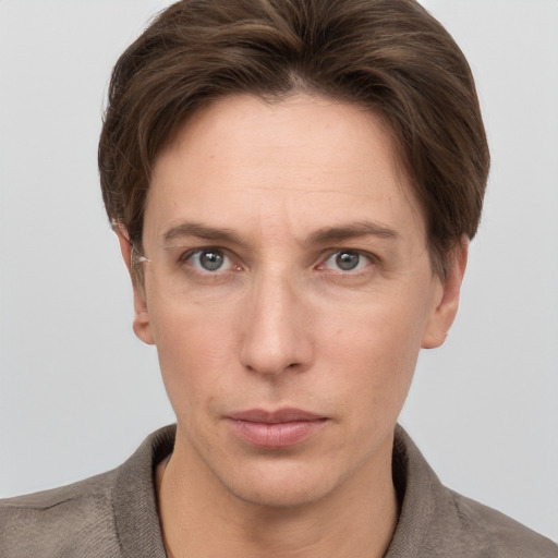 Neutral white adult female with short  brown hair and grey eyes