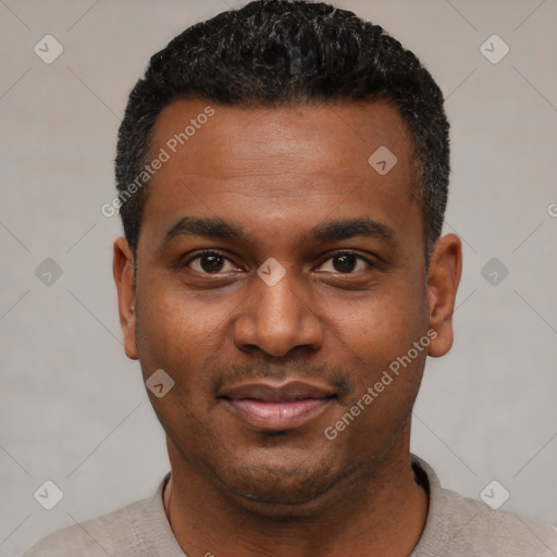 Joyful black young-adult male with short  black hair and brown eyes