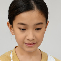 Joyful white child female with short  brown hair and brown eyes