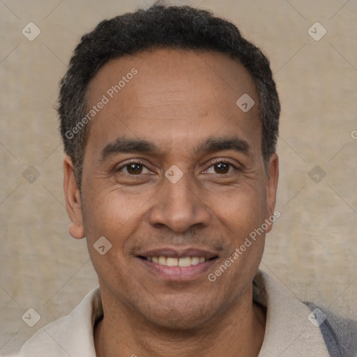 Joyful latino adult male with short  black hair and brown eyes