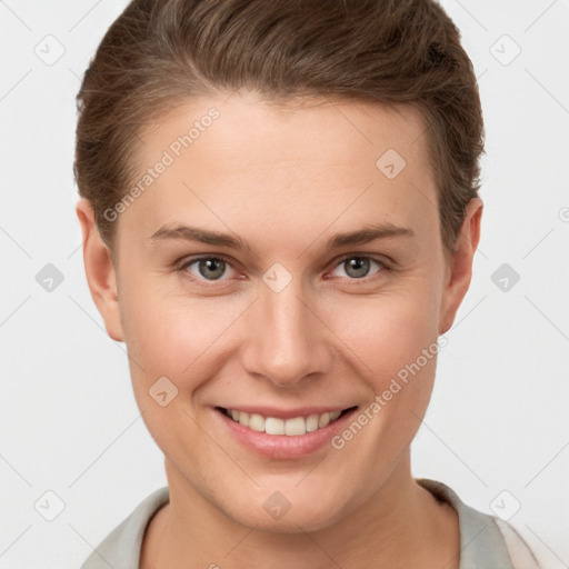 Joyful white young-adult female with short  brown hair and grey eyes