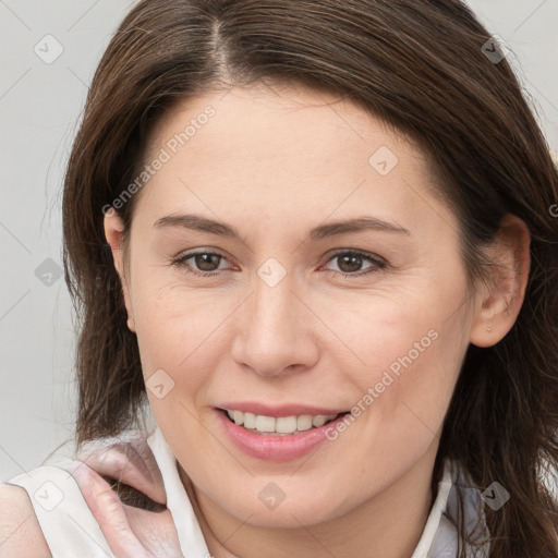 Joyful white young-adult female with long  brown hair and brown eyes