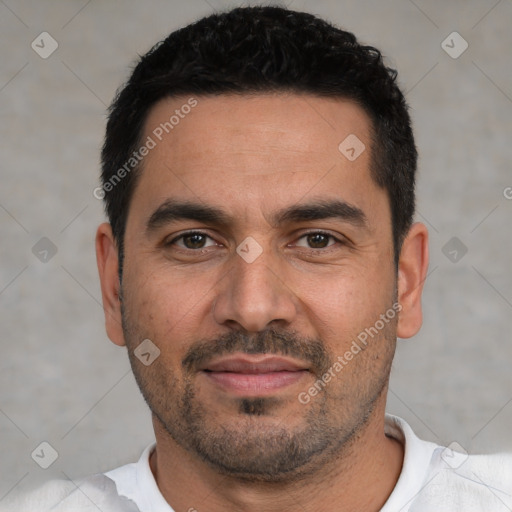 Joyful white young-adult male with short  black hair and brown eyes