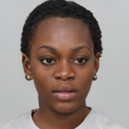 Neutral black young-adult female with short  brown hair and brown eyes