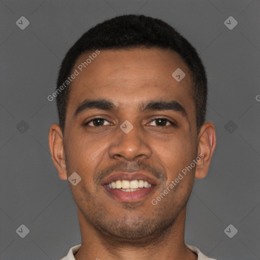 Joyful black young-adult male with short  brown hair and brown eyes