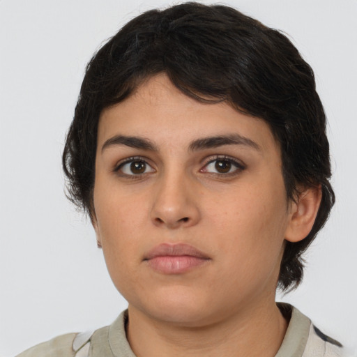 Neutral latino young-adult female with medium  brown hair and brown eyes
